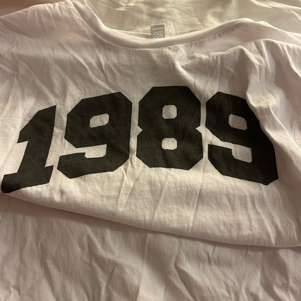From Amazon for the Taylor Swift concert. Worn once. White and black lettering.